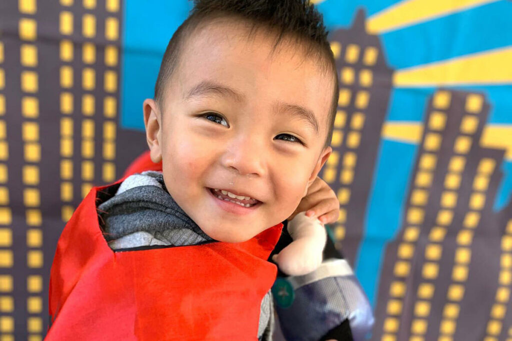young-asian-boy-playing-superhero